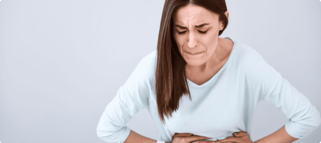 sibo-woman-holding-her-tunny-feeling-uncomfortale-scaled-1